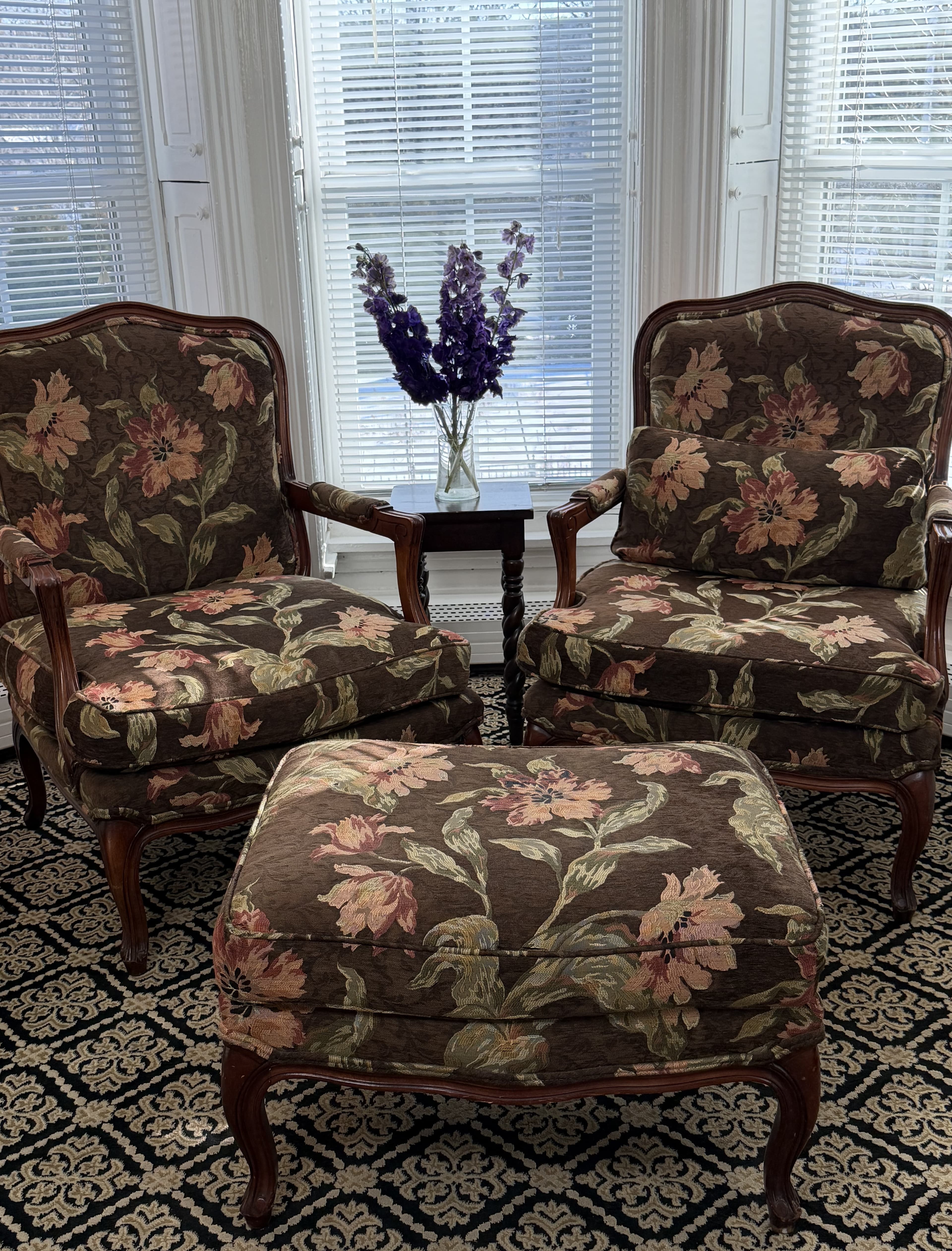 View of bay windows & sitting area with flowers
