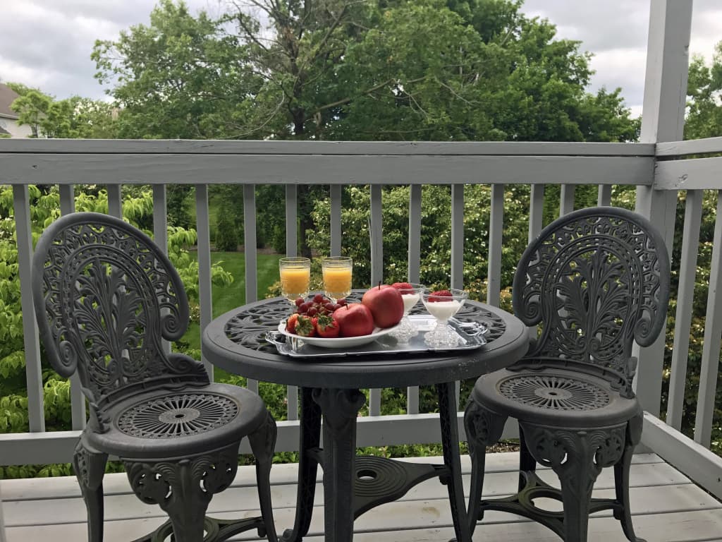 View of balcony with breakfast on the table