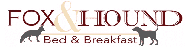 Logo for Fox & Hound Bed & Breakfast featuring stylized dogs.