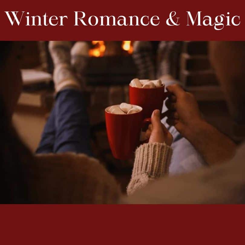 A couple holds red mugs with marshmallows while sitting by a cozy fire. A couple holds red mugs with marshmallows while sitting by a cozy fire.