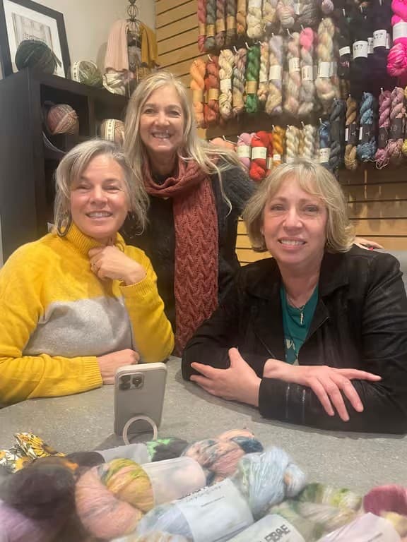 Knitting retreaters at a yarn shop