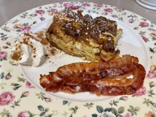 Quick Pic of Pumpkin pie French Toast on a plate with Bacon and whipped cream